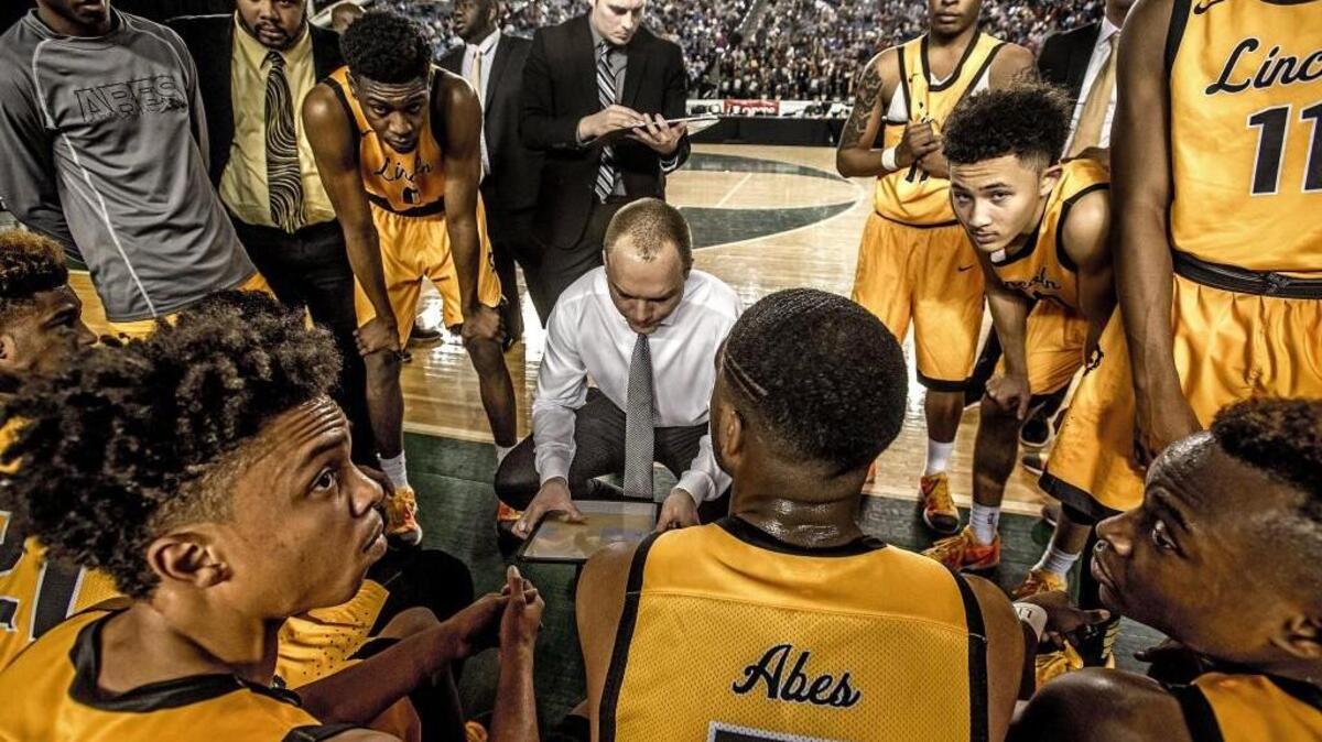 Abes’ coach Aubrey Shelton talks to his team in the fourth quarter during Lincoln’s loss to Rainier Beach on Thursday at the Tacoma Dome.