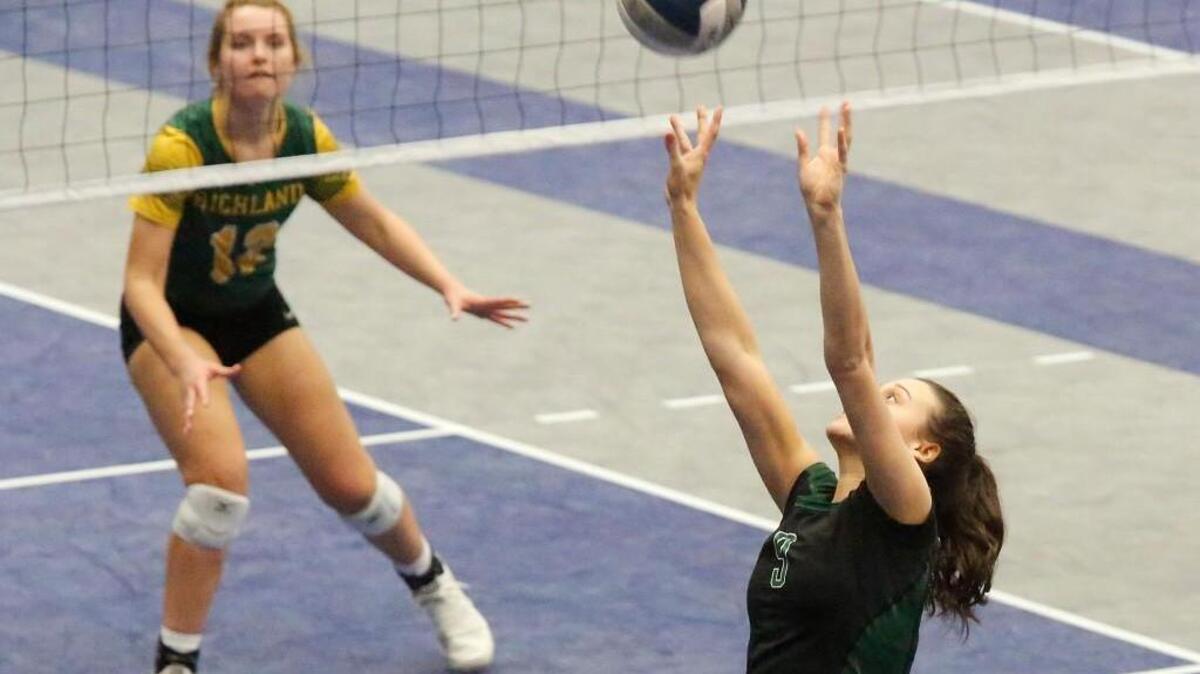 Jadyn Mullen (9) of the Emerald Ridgr Jaguars sets the ball during Friday's first-round match against the Richland Bombers in the 4A State Volleyball Championships at the Toyota Center in Kennewick.