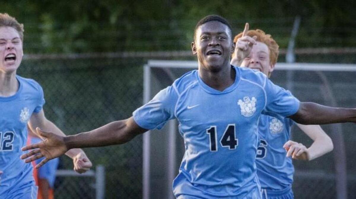 Mount Rainier’s Manuel Chaparro-Burgos, 14, celebrates with teammates after scoring the winning goal in the second overtime to beat Curtis, 1-0, at Curtis High School in University Place on Thursday.