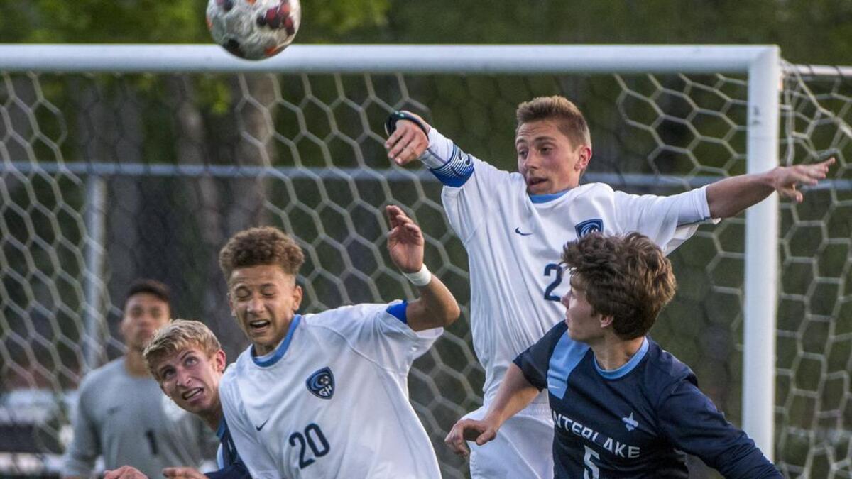 Gig Harbor defenders Nate Jones and Max Frank of go up against Owen Gortner and Nick Peterson of Interlake High School in a boys 3A soccer playoff game at Roy Anderson Field in Purdy, May 15, 2018. Gig Harbor beat Interlake, 2-1.
