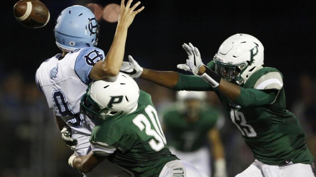 Peninsula’s Braeden Potter (30) sacks Nick Yockey (9), forcing a fumble in the second quarter. Gig Harbor had three turnovers.