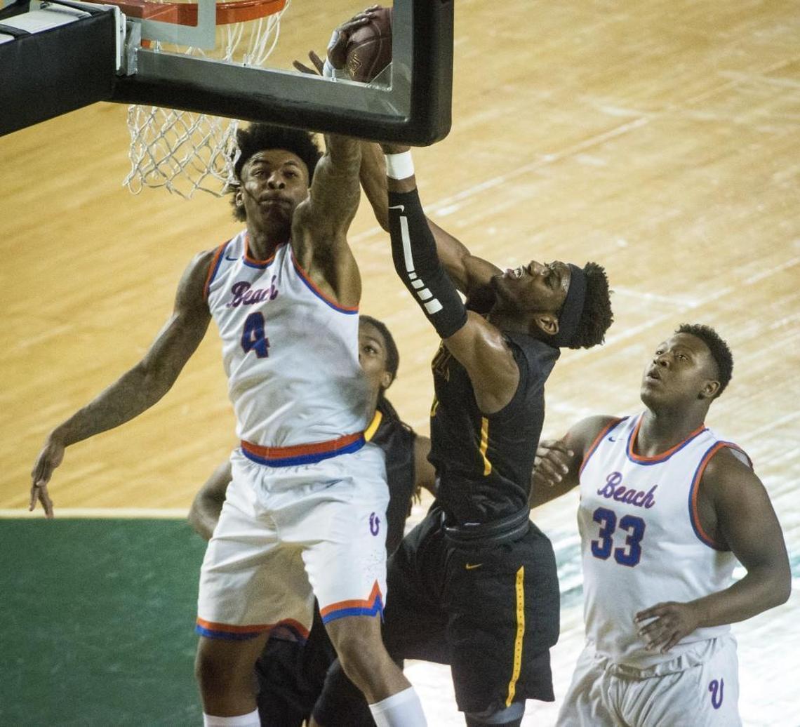 Rainier Beach's Kevin Porter (4) blocks a shot by Lincoln's Willie Thomas III (5) in the first quarter. Lincoln played Rainier Beach in a semifinal bracket game at the Hardwood Classic state basketball tournament at the Tacoma Dome in Tacoma, Wash., on Friday, March 2, 2018.