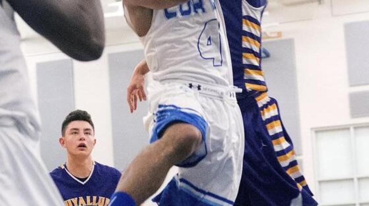 Glenn Jordan, who was Curtis’ second-highest scorer with 23 points, drives on Puyallup’s Deven Neff. Jordan also dished out nine assists in the win.