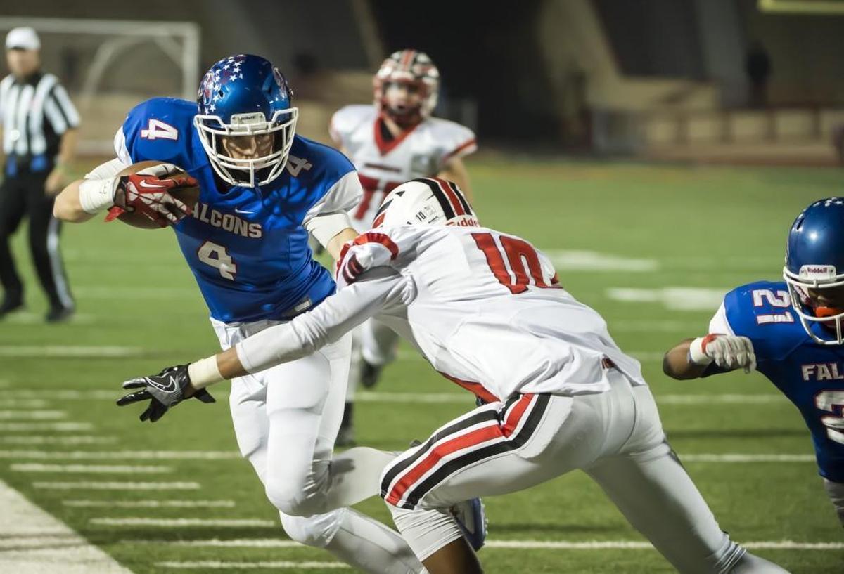 Christian Brothers Falcons Spencer Webb (4), runs with the ball after his catch during the second quarter of the Sac-Joaquin Section Division I football playoff game between the Christian Brothers Falcons and Cordova Lancers at Hughes Stadium, Friday Nov 11, 2016.