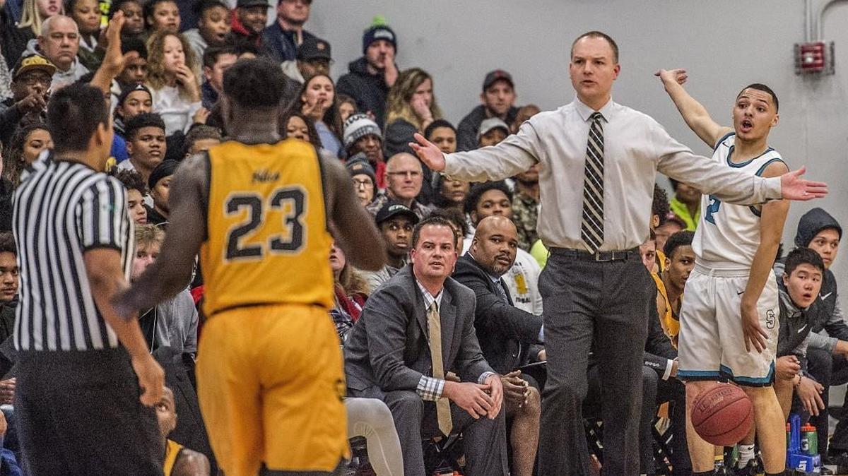 Abe's head coach Aubrey Shelton protests a call during Lincoln High School's thrilling 68-62 win against the Spanaway Lake Sentinels at Spanaway Lake Wednesday, Jan. 3, 2017. Winner takes over atop the 3A Pierce County League standings.
