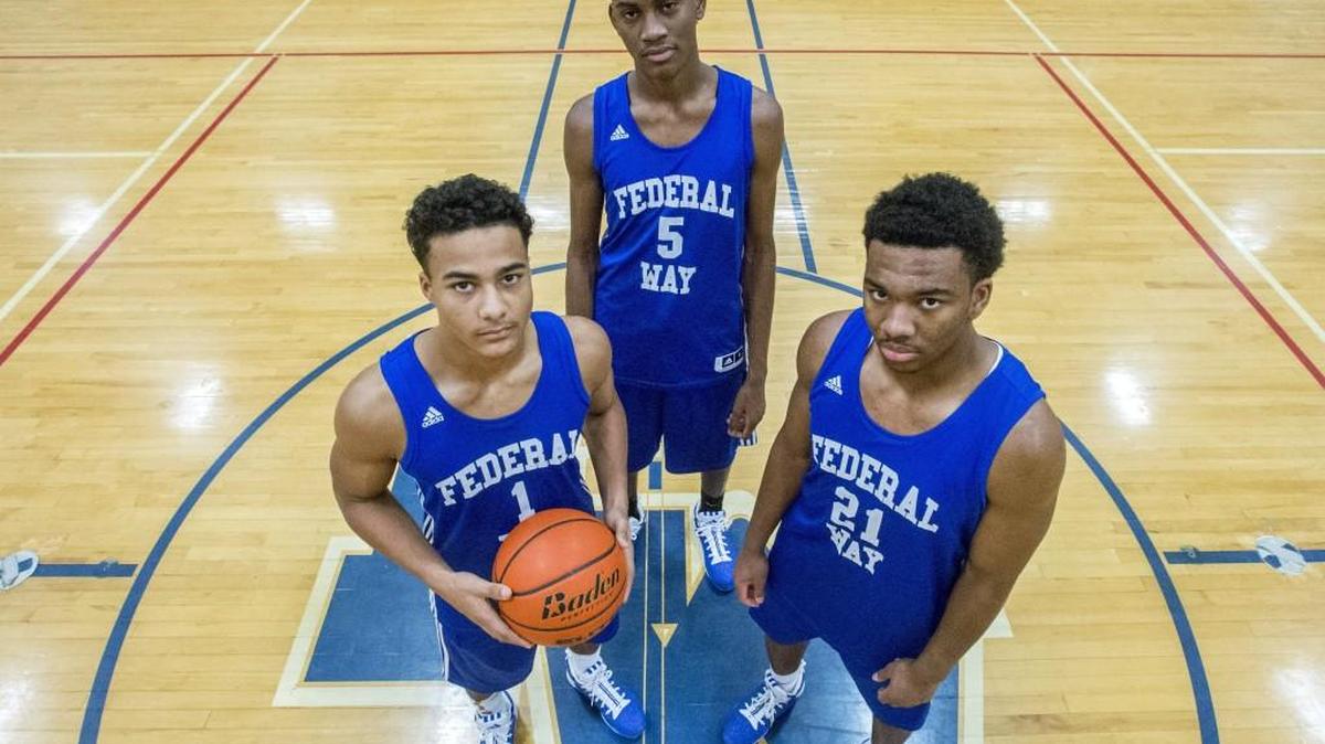 D'Jimon Jones (left), Jalen McDaniels, and Christian Jones of the Federal Way Eagles basketball team, December 12, 2015.