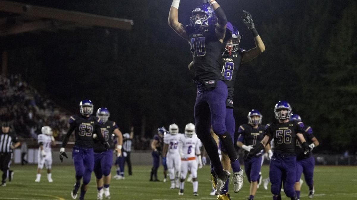 Puyallup's Landen Neff (40) and Darius Morrison (18) celebrate a touchdown in the third quarter. Graham-Kapowsin played Puyallup in a football game at Sparks Stadium in Puyallup, Wash., on Thursday, Oct. 5, 2017.