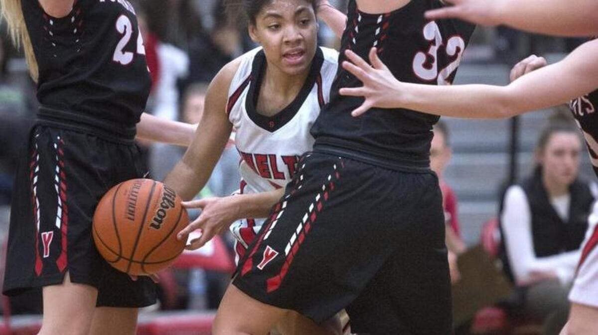 Shelton's Jasmine Griffin is shut off by Yelm defenders Chloe Zimmerman (left) and Jamie Connally during Wednesday night's girls basketball game at Shelton High School on Jan. 11, 2017.