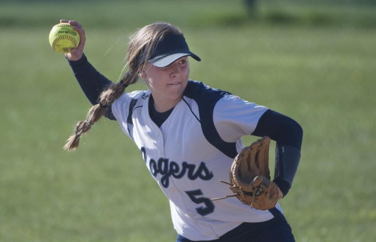 Rogers' Raigan Barrett (5) fields the ball and throws to first for an out in the fourth inning. Bonney Lake played Rogers in a softball game at Bonney Lake High School in Bonney, Wash., on Friday, April 21, 2017.