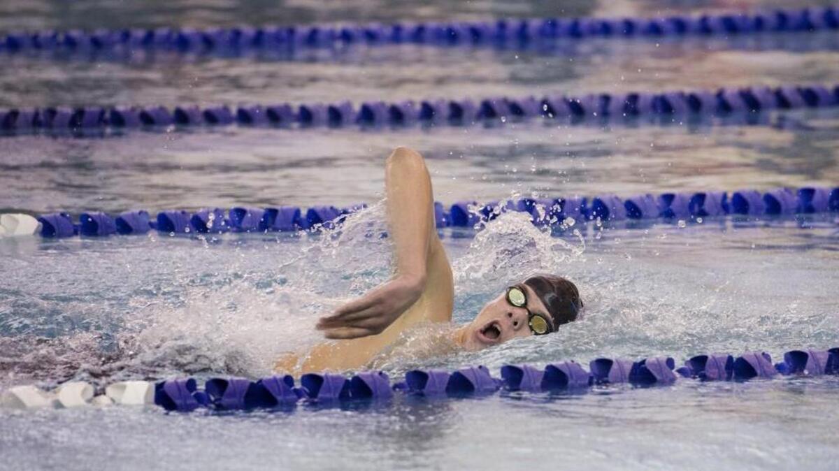 Without a competitor in sight, Gig Harbor's Ryan Grady swims to an easy victory in the 500-yard freestyle at districts Feb. 6 in University Place. Grady, who also took first in the 200-yard freestyle, was the only swimmer to win two events.