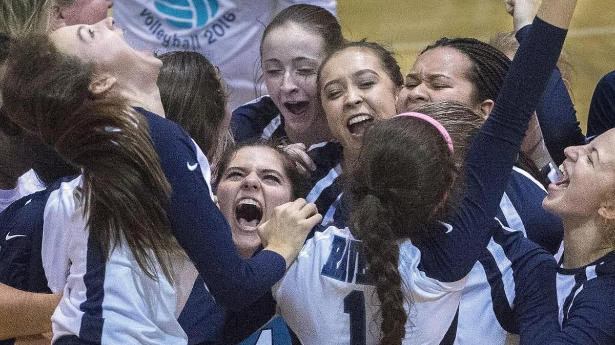 Raven players celebrate their 3-2 set win over Bellarmine Prep at Kentwood High School on Saturday, Nov. 5, 2016.