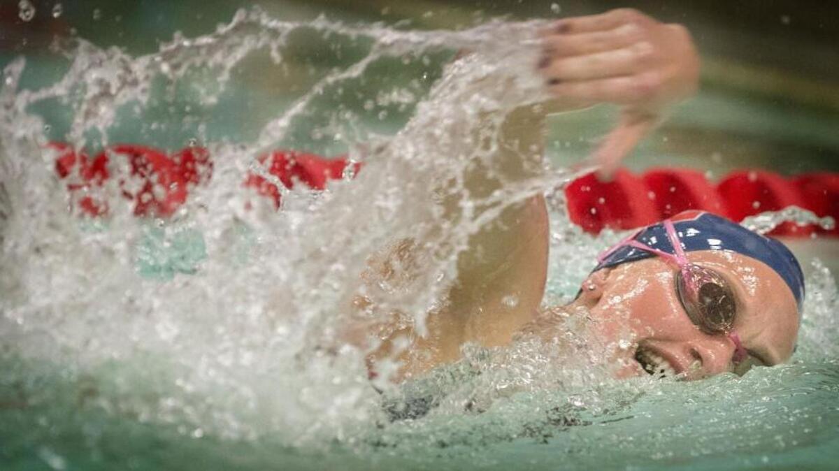 
Wilson’s Madeleine Dodge swims her way to victory in the 200 freestyle during a meet against North Thurston on Tuesday. Dodge also won the 100-yard freestyle in a state-qualifying time of 55.59 seconds. 
