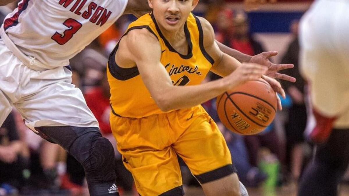Trevante Anderson of Lincoln High School drives in a 4A Narrows League boys basketball game at Wilson, January 6, 2016. Lincoln beat Wilson 73-59.