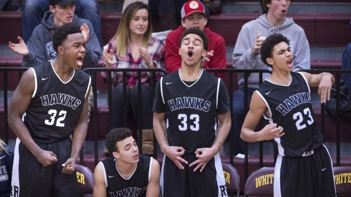 River Ridge players, from left, Kelle Sanders, Trey'vonne Dorfner, Issiah Scott and Kolton Knox celebrate a 3-point shot as the Hawks run out to a 40-point lead against White River. River Ridge is undefeated in 2A SPSL play at 10-0 and are 14-1 on the season.