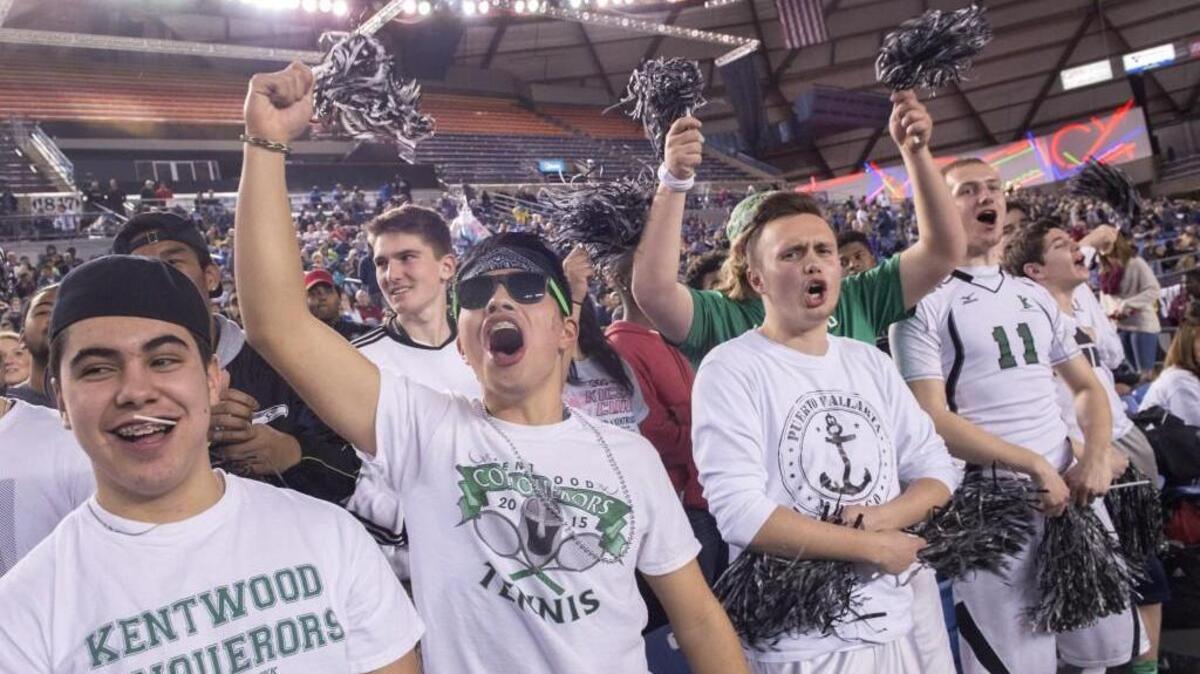 Kentwood fans whoop it up Friday during the Conquerors’ semifinal win over Curtis.