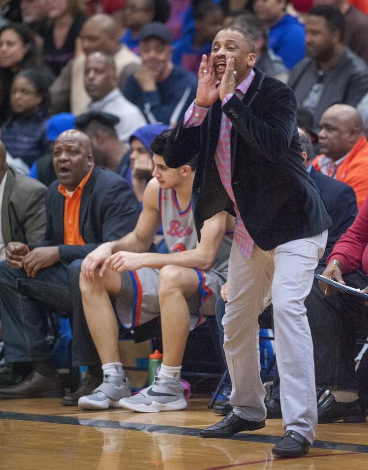 Rainier Beach head coach Mike Bethea exhorts his troops. Photo taken at Rogers High in Puyallup on Friday, Feb. 26, 2016.