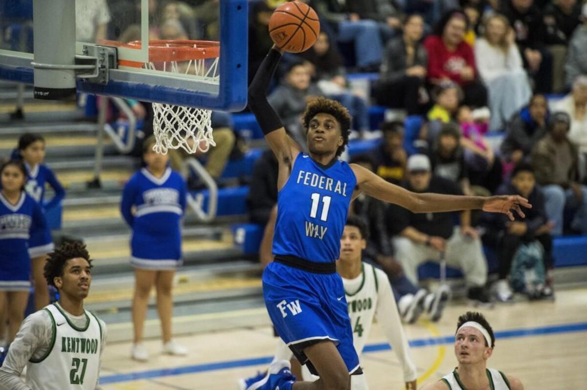 Federal Way’s Jaden McDaniels throws down a dunk in the third quarter. Federal Way played Kentwood in a basketball game to decide the 4A NPSL title at Tahoma High School in Maple Valley, Wash., on Saturday, Feb. 3, 2018.