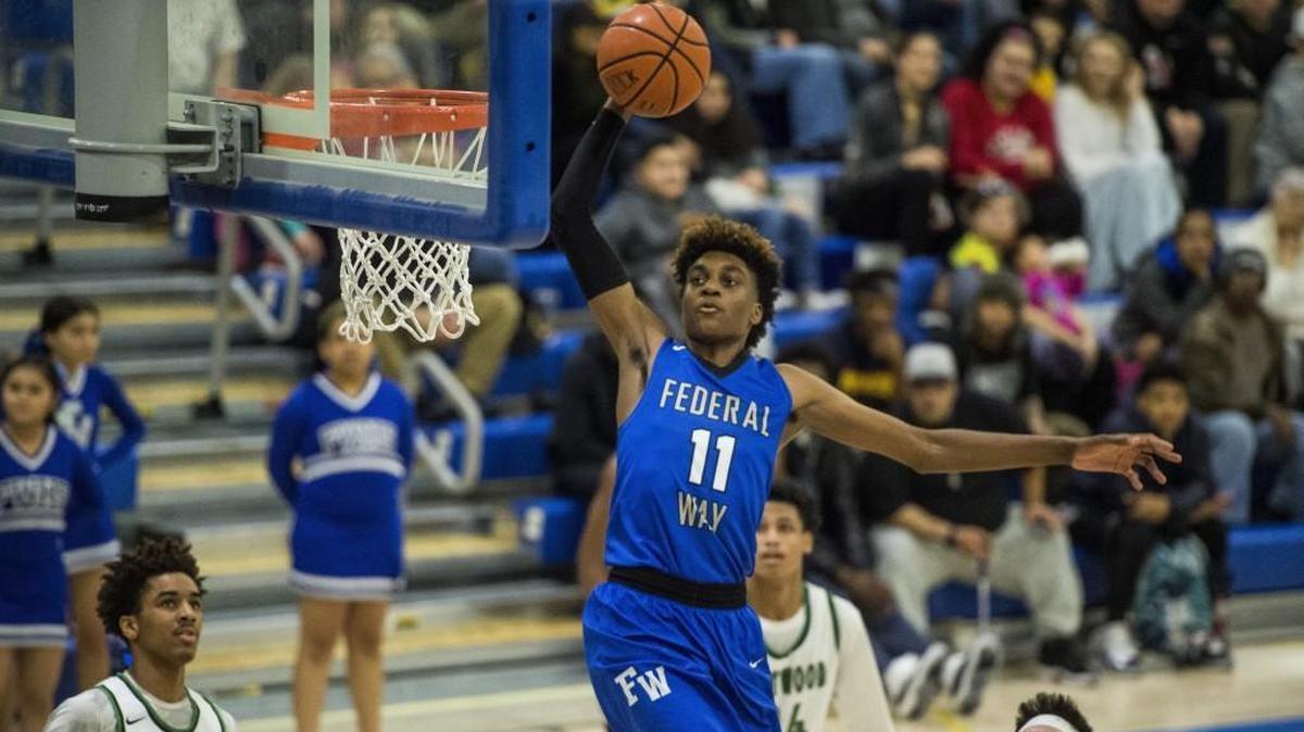 Federal Way’s Jaden McDaniels throws down a dunk in the third quarter. Federal Way played Kentwood in a basketball game to decide the 4A NPSL title at Tahoma High School in Maple Valley, Wash., on Saturday, Feb. 3, 2018.