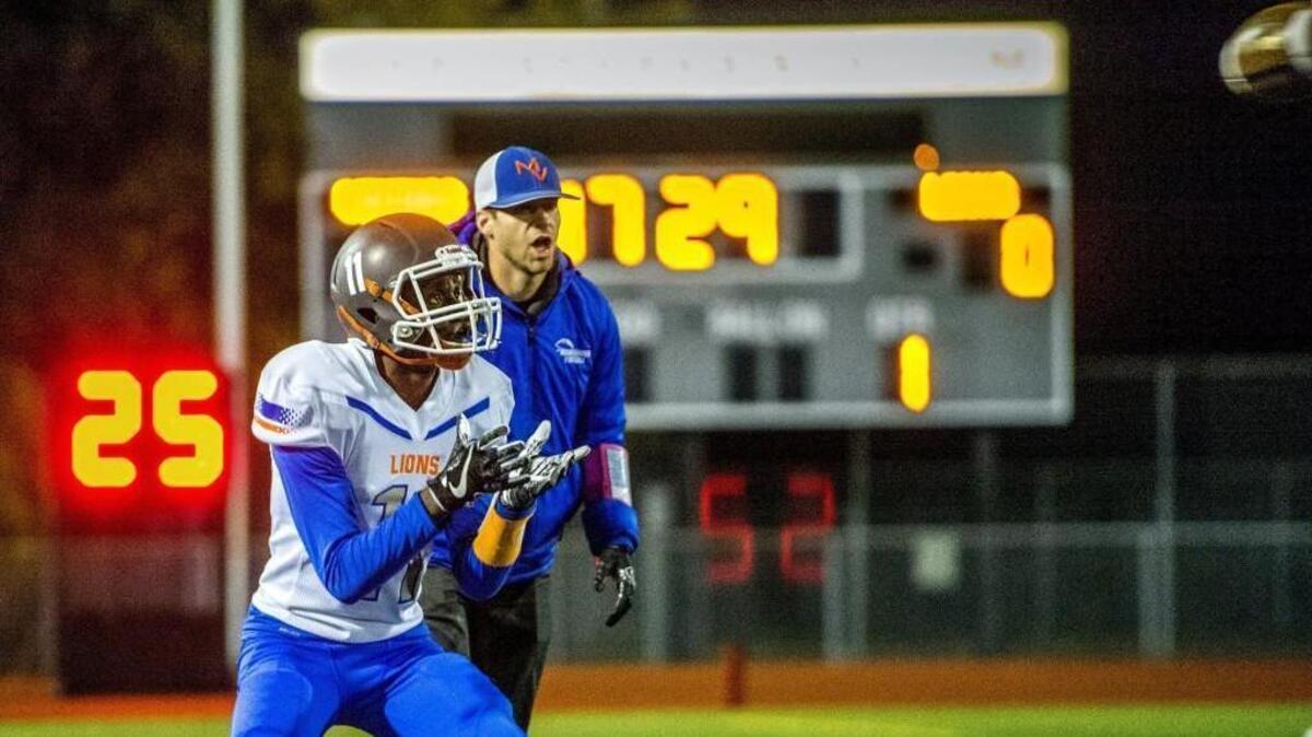 Isaac Wanlemvo of Auburn Mountainview catches a pass during pregame warmups before a 4A football game in Sparks Stadium in Puyallup, November 3, 2017.