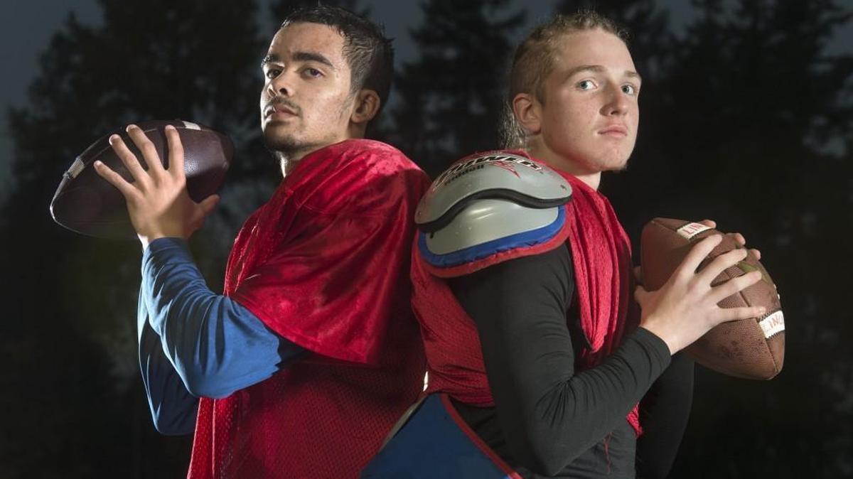 Lincoln quarterbacks (from left) senior right-hander Jaylen Antoine and sophomore left-hander Caden Filer at Lincoln High School in Tacoma on Wednesday, Nov. 8, 2017.