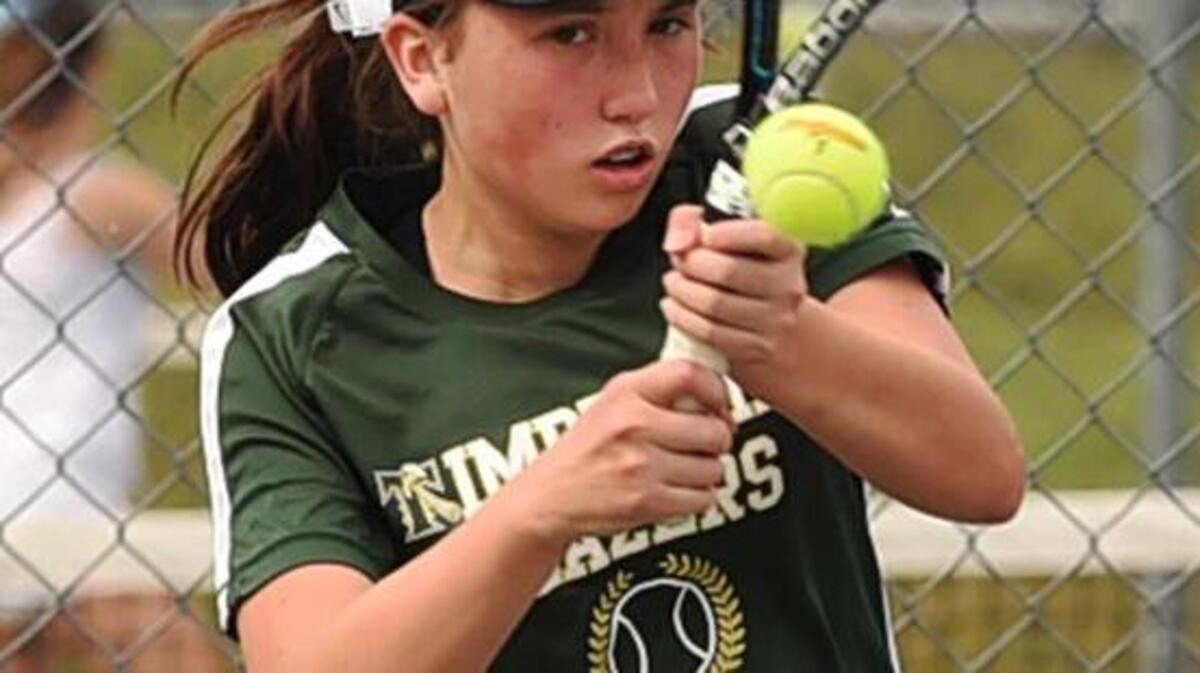 Timberline’s Angela Schuster hits a backhand return against Gig Harbor’s Joyce Parker this week. In a three-set match, Schuster gained her first victory over Parker after several losing attempts.
