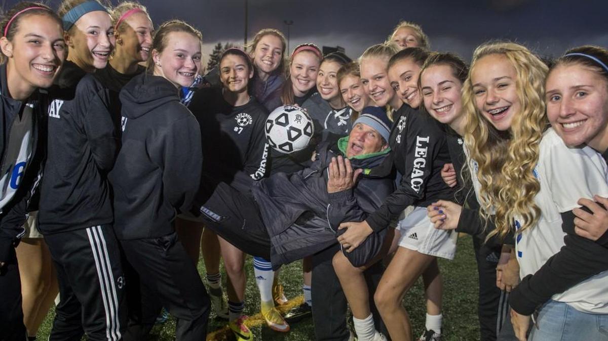Fife coach Tony Crudo, who played in the North American Soccer League with the Sounders, gets a ride Thursday from his players in Fife as they enjoy another successful season.