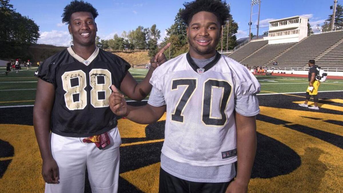 Quazzel White, 17, and Giovonni White, 15, are the starting offensive tackles for the Lincoln High School football team. Quazzell is a senior and Giovonni a sophomore. They prank people into believing they are brothers. Photo taken on Thursday. Sept. 8, 2016.