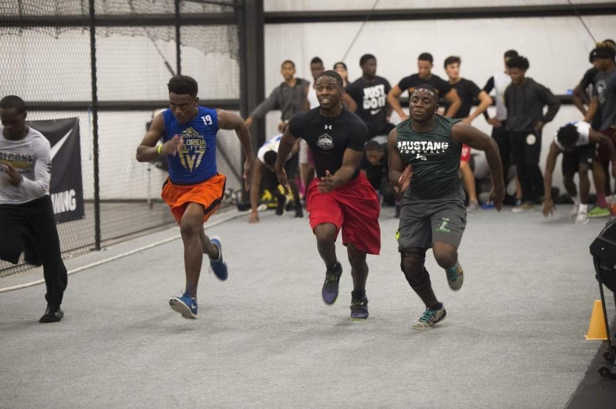 Players on Air5, a 7-on-7 football team coached by Former Southeast High School football star Adrian McPherson, run sprints during training on Thursday evening, March 2, 2017 at Wave Fitness in Sarasota.