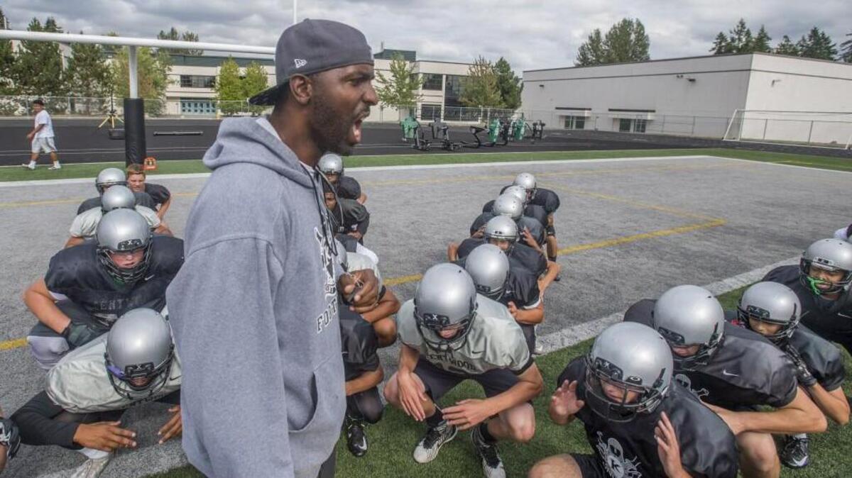 Head coach Mike Bush of Kentwood High School in football practice, August 30, 2016.