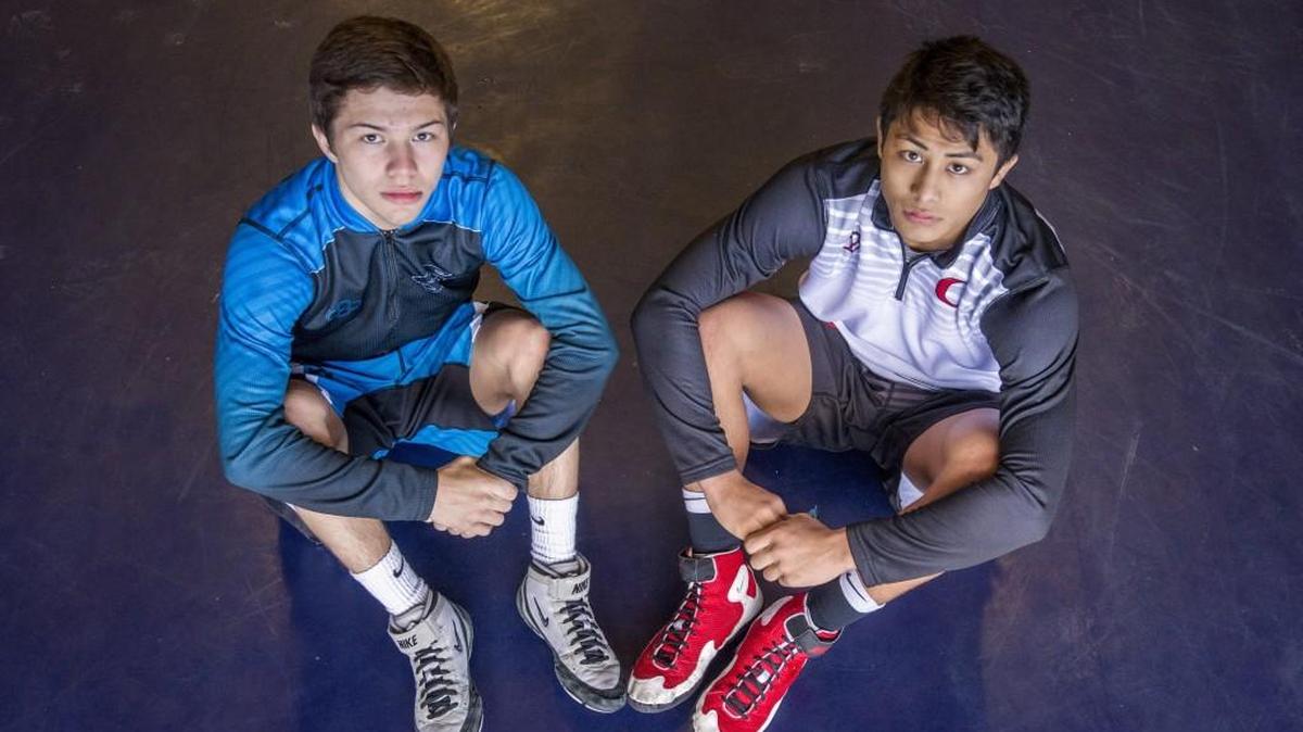 Bonney Lake wrestler Brandon Kaylor (left) and Orting wrestler Alex Cruz grew up wrestling together and are planning to head into big NCAA programs. December 20, 2017