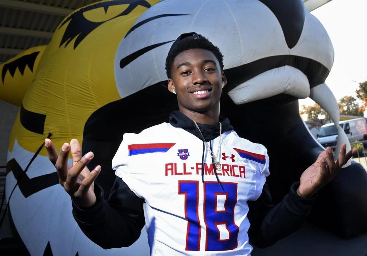 Edison High's Steve Stephens shows off his new Under Armour All-American Game jersey after receiving it in a ceremony at Edison's quad Thursday afternoon, Nov. 30, 2017 in Fresno.