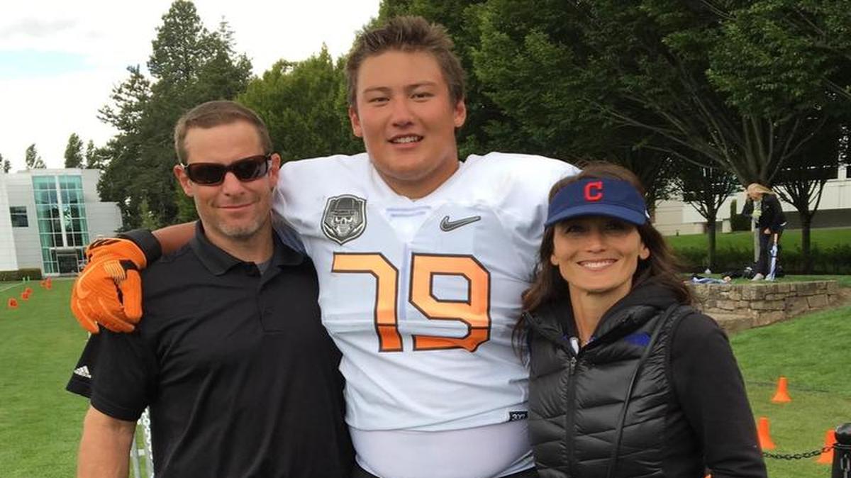 Foster Sarell (middle) poses with his father, Ryan (left) and mother Pam (right) at a prestigious football camp run by Nike in Eugene, Oregon, called The Opening. Sarell was selected as the camp’s offensive line MVP.
