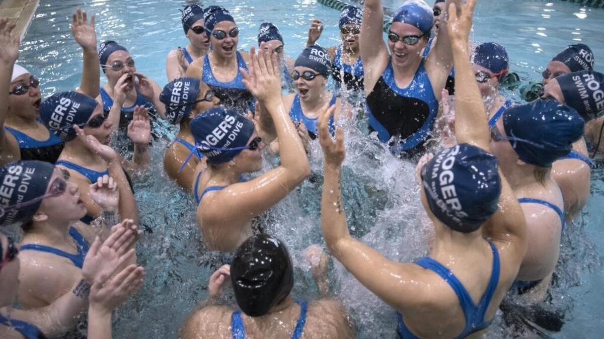 
Rogers swimmers do a team cheer before the South Sound Swim Relays at The Evergreen State College pool in Olympia on Saturday, Oct. 3, 2015.
