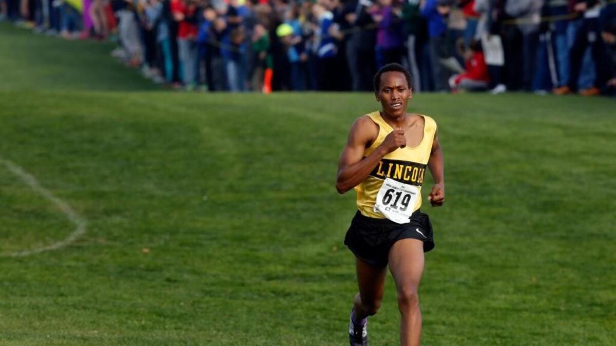 Lincoln High School's James Mwaura leaves the rest of the pack in the dust as he approaches the finish line in the boys 3A race on November 5, 2016 during the WIAA Cross Country Championships at Sun Willows Golf Course in Pasco.