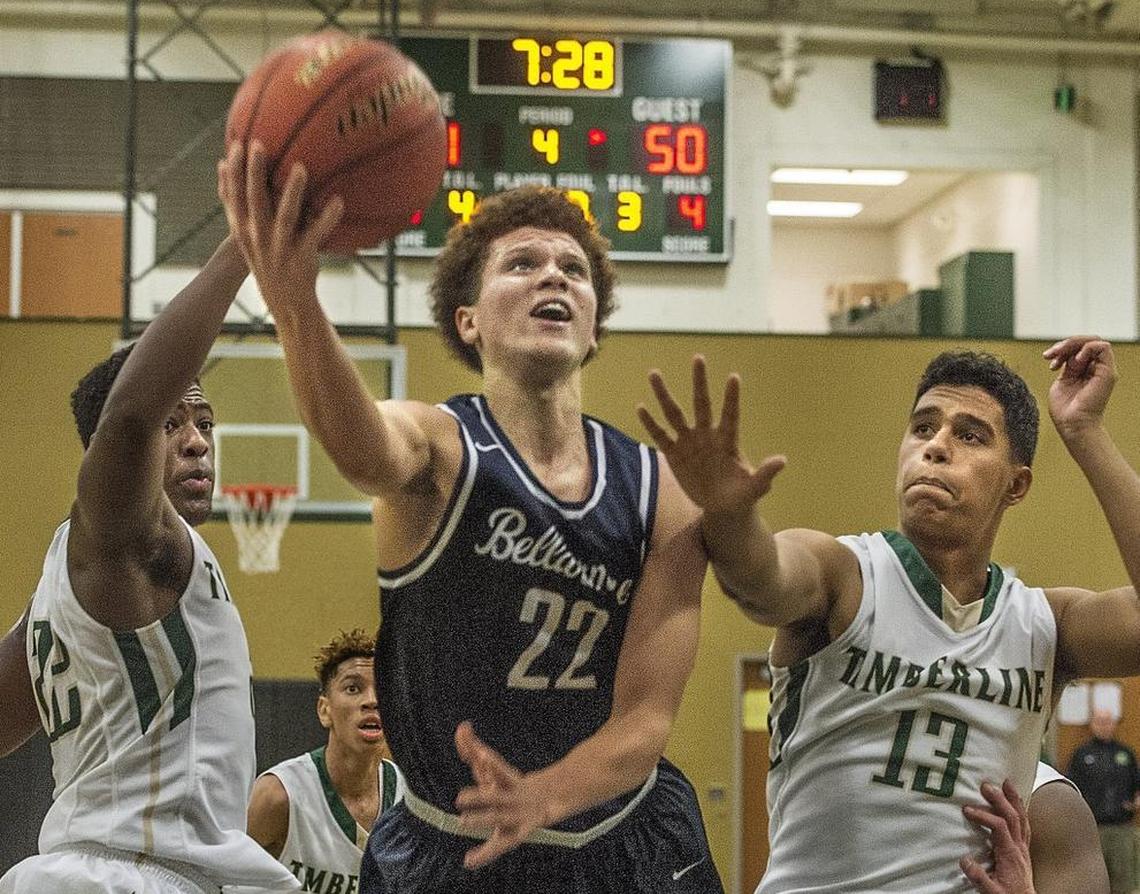 Bellarmine Prep’s Malachi Flynn splits Timberline defenders Jarry Bush, left, and Jaelen Bush to score Wednesday in Lacey. Flynn poured in 34 points in the victory.