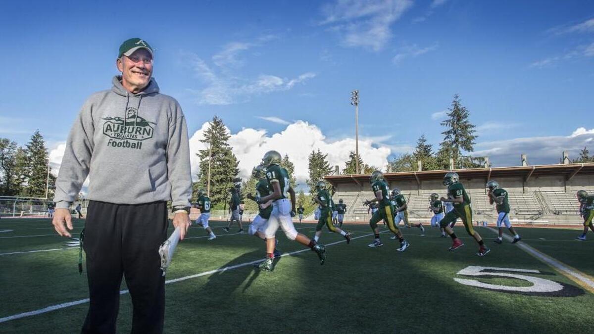 Gordy Elliott, before a practice of the Auburn High School football team Wednesday. Elliott has his Trojans off to a 5-0 to start the season after having just three wins all of last season. The resurgence of the football program is just one interesting aspect of Elliott’s story. His football family includes sons-in-law, Curtis coach Chris Paulson and Gig Harbor coach Aaron Chantler.