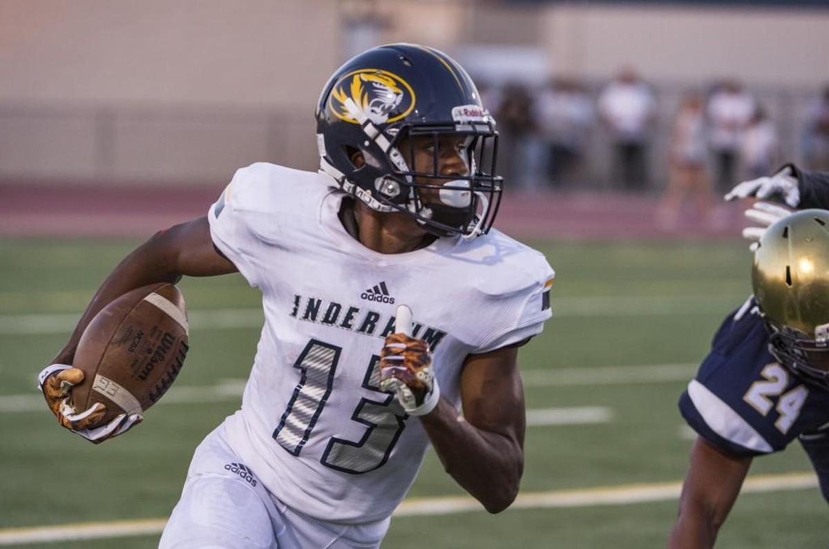 Inderkum Tigers Isaah Crocker (13), runs with the ball during the first quarter as the Elk Grove thundering Herd varsity football team host the Inderkum Tigers, Friday Aug 25, 2017. photo by Brian Baer