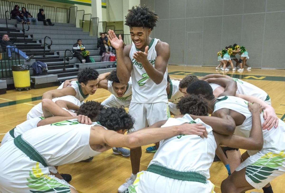 Demetrius Crosby claps as his Foss teammates make a unity circle prior to the league matchup against Fife. Photo taken in Tacoma on Tuesday, Jan. 16, 2018.