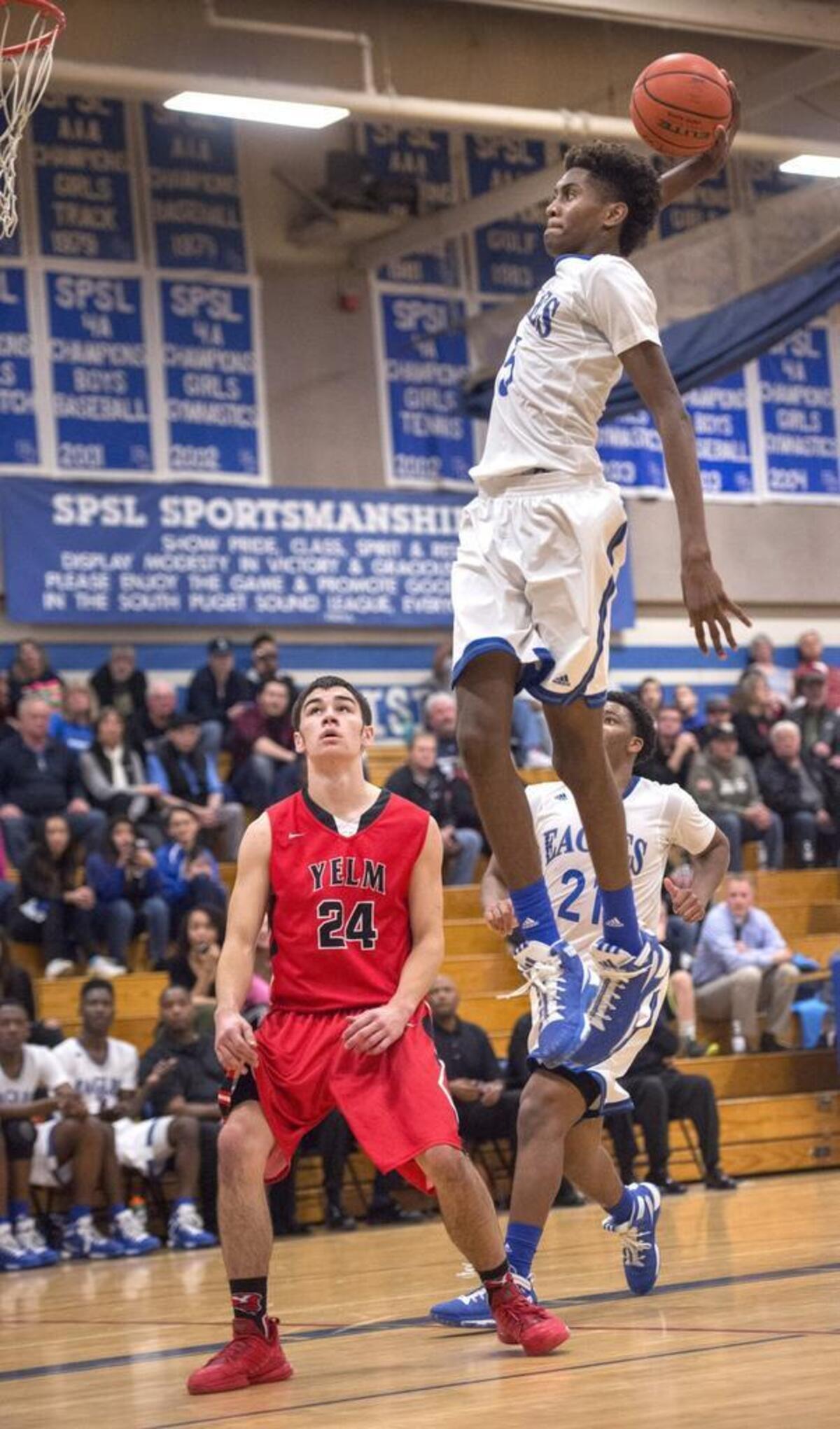 Federal Way’s Jalen McDaniels is nearly eye-level with the rim as he soars in for a dunk. Photo taken in Federal Way on Wednesday, Feb. 10, 2016.