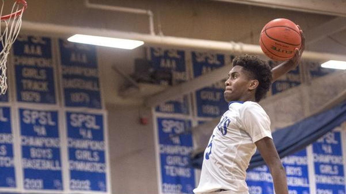 Federal Way’s Jalen McDaniels is nearly eye-level with the rim as he soars in for a dunk. Photo taken in Federal Way on Wednesday, Feb. 10, 2016.