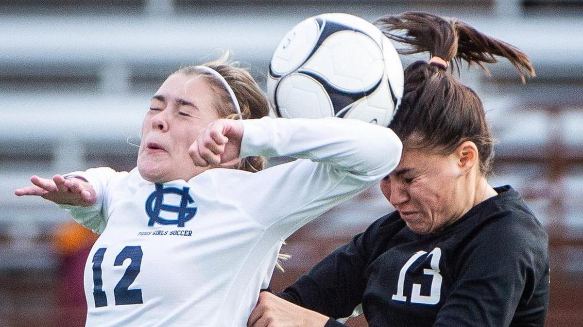 Gig Harbor’s Lily Paulson (12) and Brielle Schneider (13) go up for a header in the second half. Gig Harbor played Kamiakin in a soccer match at Sparks Stadium in Puyallup, Wash., on Friday, Nov. 16, 2018.