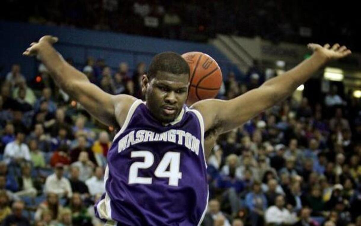 Forward Jamaal Williams (24) of No. 13 Washington follows through on a slam-dunk over No. 11 UCLA in the first half of their Pac-10 basketball game in Los Angeles Saturday, Jan. 14, 2006. Williams scored a team-high 14 points as Washington won, 69-65. (AP Photo/Reed Saxon) ORG XMIT: CARS103