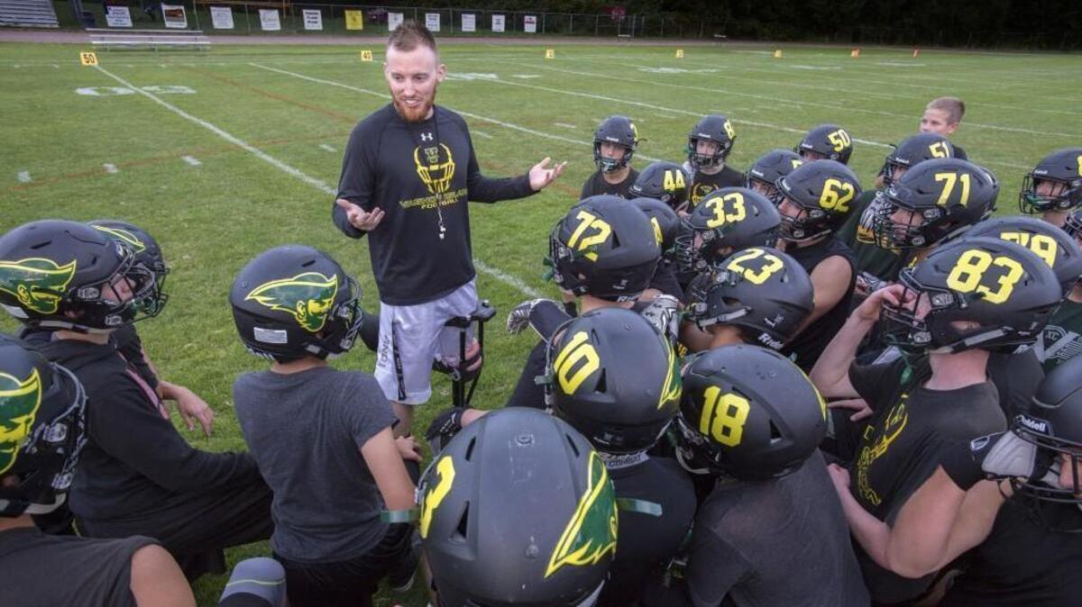 
Vashon Island coach Brynie Robinson talks to his team about the next opponent during football practice at Vashon Island High School on Thursday, Sept 24, 2015.
