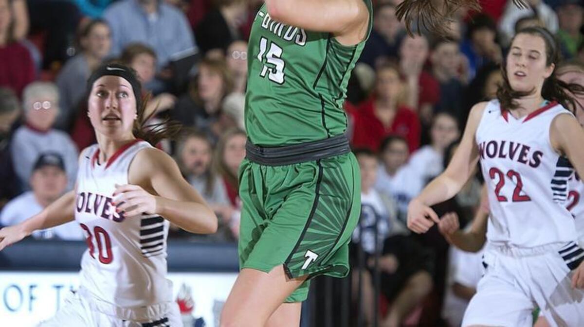 Tumwater forward Brooke Hare drives the lane between Black Hills defenders Lindsey Nurmi, left, and Emma Duff during a game Friday. The 6-foot-tall junior is more often found swatting shots and grabbing rebounds.