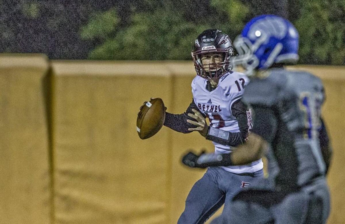 Bethel quarterback Nate Hughes (12) looks downfield for a target during the Bethel High School (4-1) vs. Stadium High School (4-1) football game at Stadium Bowl Friday, Oct. 6, 2017.