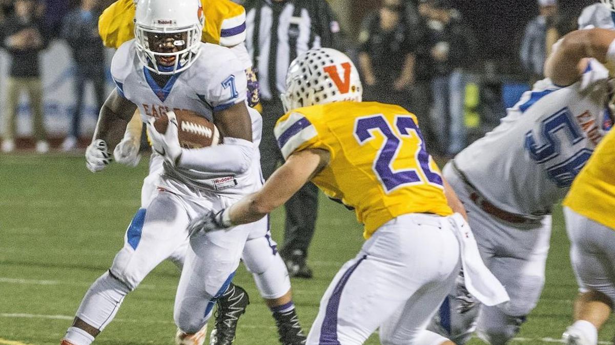 Graham-Kapowsin's Micah Smith left, gets ready to lower his shoulder on the Spartan's linebacker Jake Popejoy Thursday 09/22/16 during a match-up between the visiting Graham-Kapowsin Eagles and the Sumner Spartans. Smith scored a first half touchdown but the Eagles trailed 14-13.