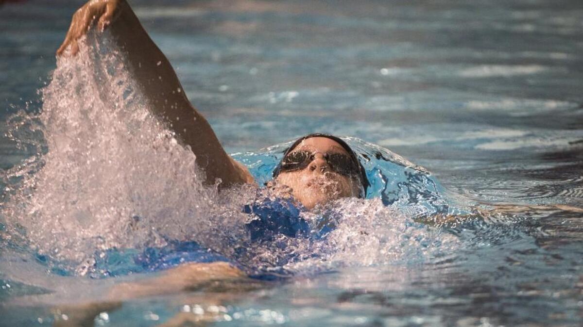 Curtis' Leigh Lopez-Silvers competes in the first leg of the 200-yard medley relay event at the 4A girls state swim and dive championships at the King County Aquatics Center in Federal Way, Wash., on Saturday, Nov. 11, 2017.