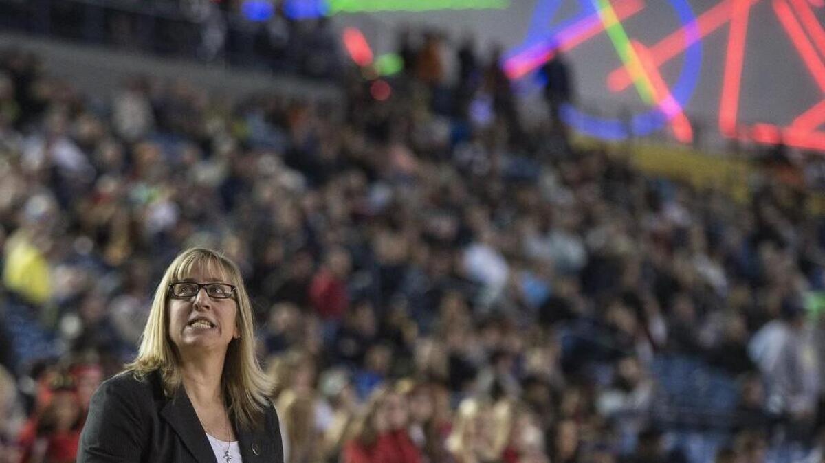 Wilson coach Michelle Birge cast a worried glance at the scoreboard as time ticked away Thursday 3/5/15 at the Tacoma Dome.