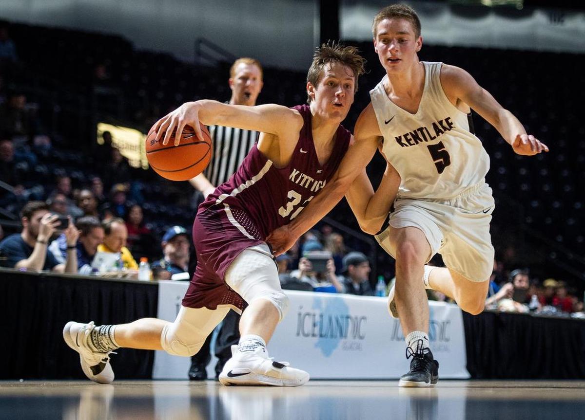 Kittitas’ Brock Ravet tries to shake off Kentlake’s Sam Morasch (5) in the second quarter. Kentlake played Kittitas in a basketball game at the Showare Center in Kent, Wash., on Monday, Jan. 21, 2019.