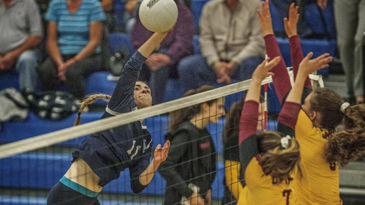 Tides co-captain Lauren Hatfield (11) spikes the ball for a point during the Gig Harbor (5-1 SSC 3A) vs Capital (6-0 SSC 3A) volleyball match Wednesday, Oct. 4 at Gig Harbor High School. This is a 1st vs 2nd place matchup that the Tides win 3-1.